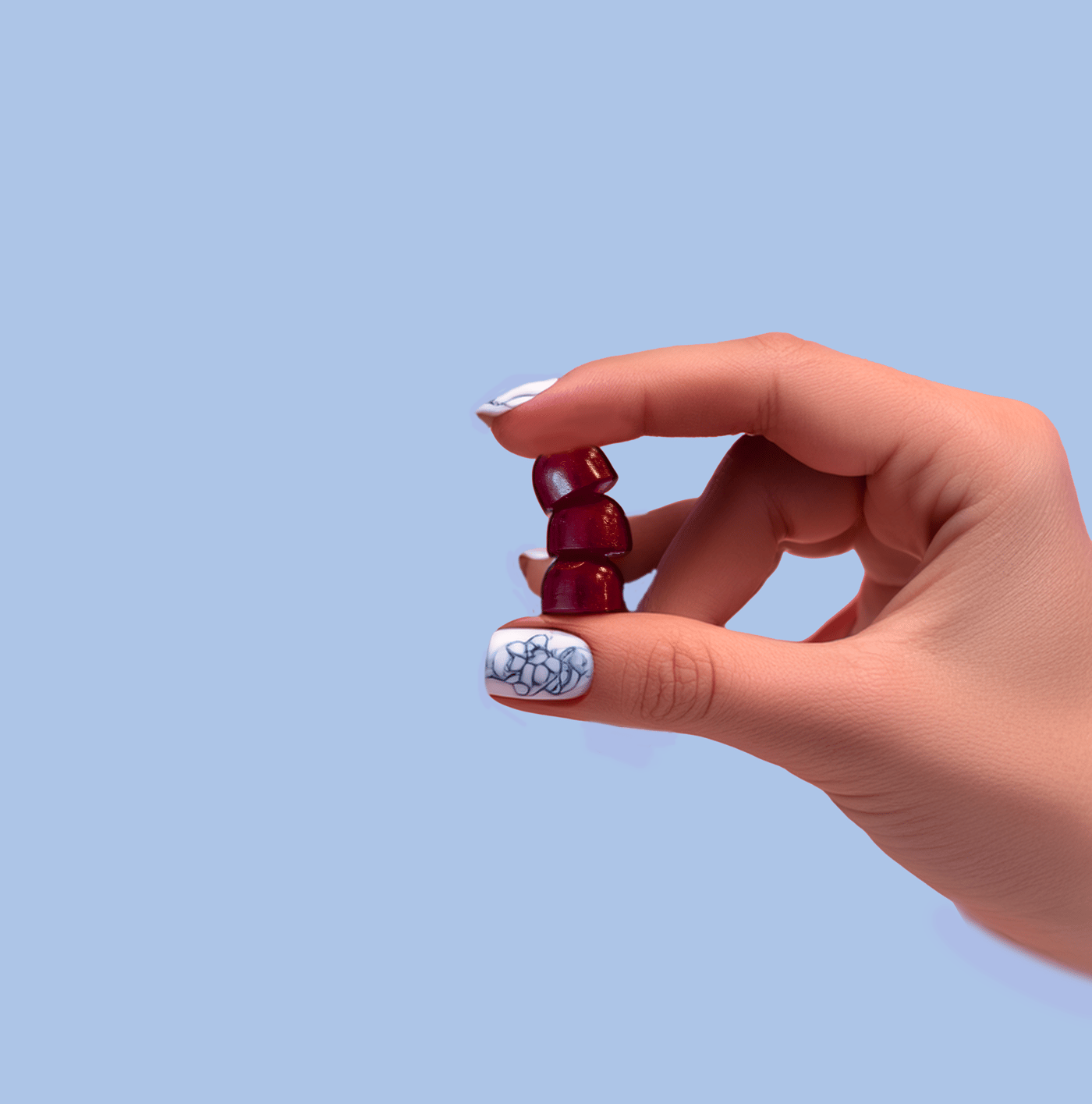 Hand holding multivitamin gummies